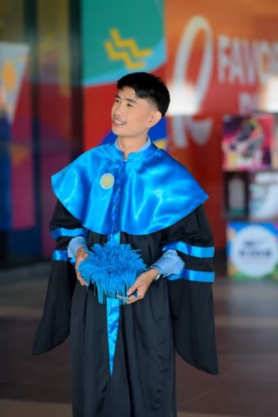 Graduation ceremony photo of Marvine 