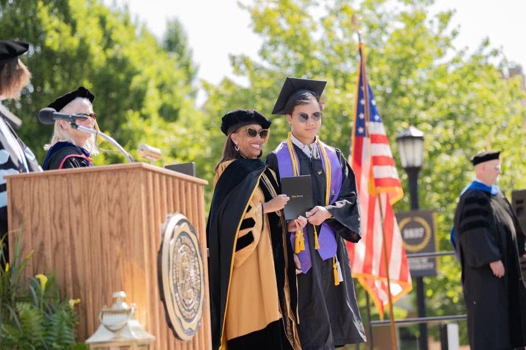 Graduation ceremony photo of Enoch 