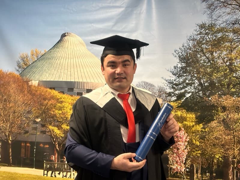 Graduation ceremony photo of Ali