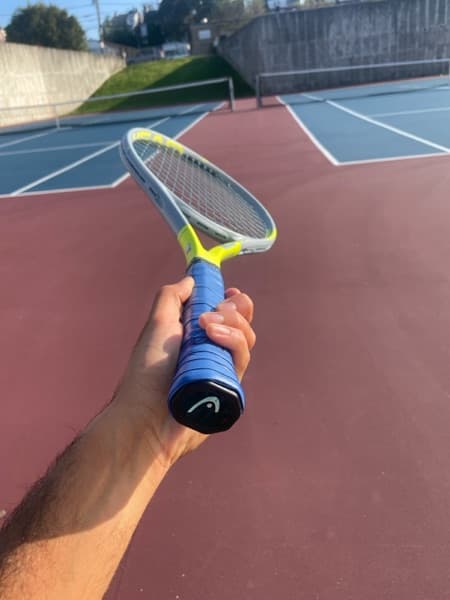 Christopher enjoying a hobby outside teaching