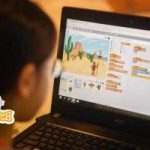child creating a Scratch project