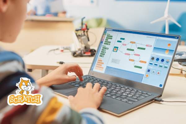 a boy creating Scratch project